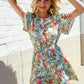 Get Whimsical Tropical Print Smocked Waist Neck Button Romper - DAVERRI FASHIONS
