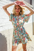 Get Whimsical Tropical Print Smocked Waist Neck Button Romper - DAVERRI FASHIONS