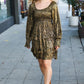 Dazzling black gold foiled smocked fit and flare dress with long sleeves