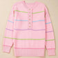 Pastel pink striped half button round neck loose fit sweater