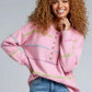 Pink contrast striped half-button round neck sweater with jeans