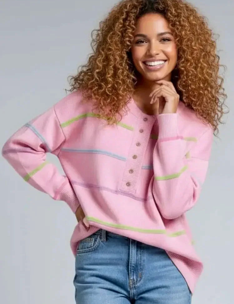 Pink contrast striped half-button round neck sweater with jeans