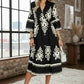 Black and white embroidered midi dress with bell sleeves by Daverri Fashions