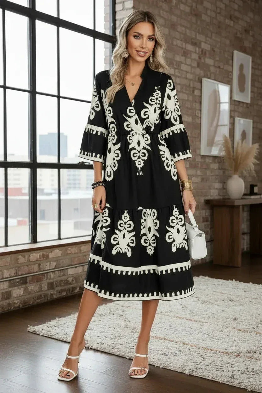Black and white embroidered midi dress with bell sleeves by Daverri Fashions