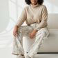 Beige turtleneck sweater paired with Seige Denim plus size jeans