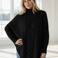 Black cable-knit turtleneck sweater with wide sleeves in plus size
