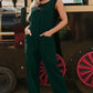 Deep green velvet V-neck corduroy jumpsuit with mesh neck panel