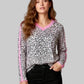 Women’s black and white leopard print V-neck long-sleeve top with pink trim