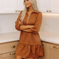 Brown textured tiered mini dress with zipper neckline and ruffled hem