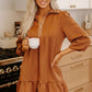 Cozy rust-colored ruffled hem zip front texture dress