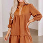 Ruffled hem zip front texture dress with brown textured fabric, zipper neckline, three-quarter sleeves, and tiered skirt