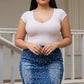 Plus size blue denim mini skirt with pearl studs and frayed hem