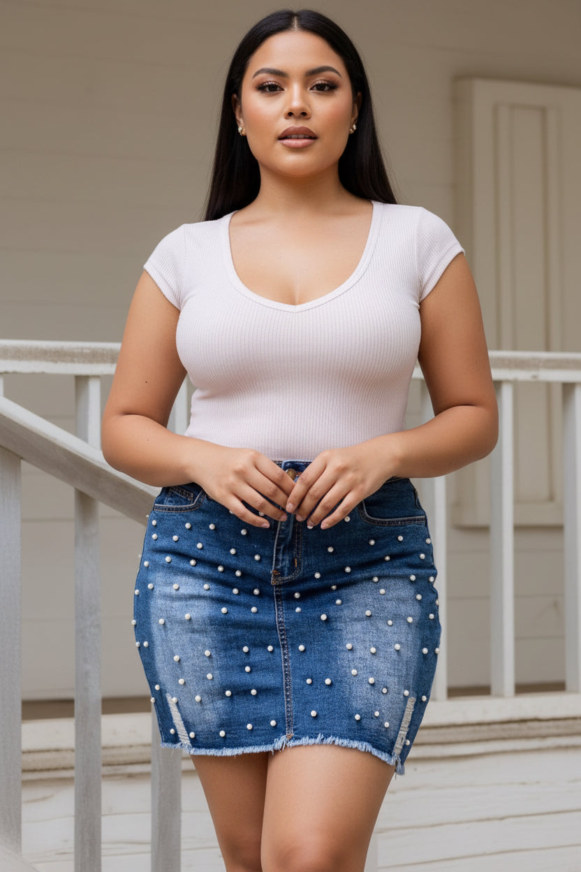 Plus size blue denim mini skirt with pearl studs and frayed hem