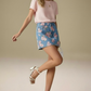 Daverri floral print denim mini skirt in blue with pink pattern