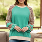 Plus size printed raglan sleeve sweatshirt in teal and beige with floral sleeves