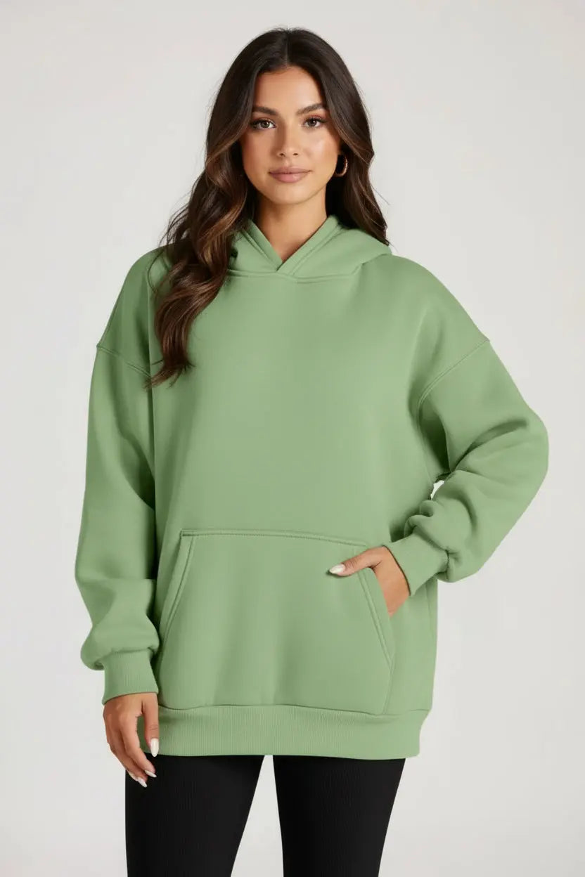 Soft sage green oversized kangaroo pocket long sleeve hoodie with ribbed cuffs