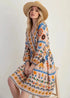 Bohemian floral print long sleeve mini dress in off-white with orange blue green patterns
