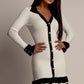 Daverri ribbed knit sweater dress with black contrast trim and silver buttons