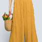 Umgee mustard yellow linen wide-leg pants with frayed ruffle sides and pockets