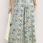 Umgee beige linen wide-leg pants with blue botanical print and raw frayed hems