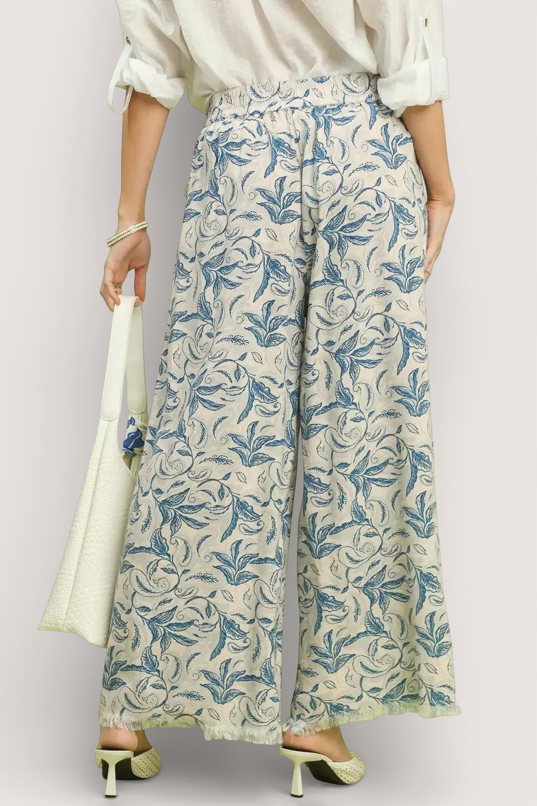 Umgee beige linen wide-leg pants with blue botanical print and raw frayed hems