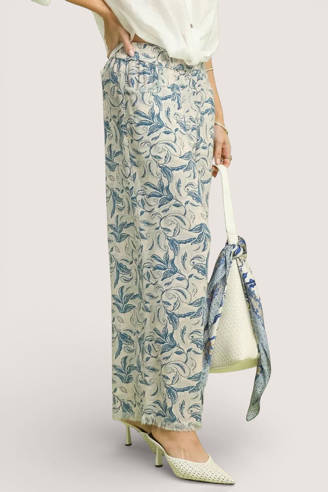 Umgee beige linen wide-leg pants with blue white botanical print raw hems