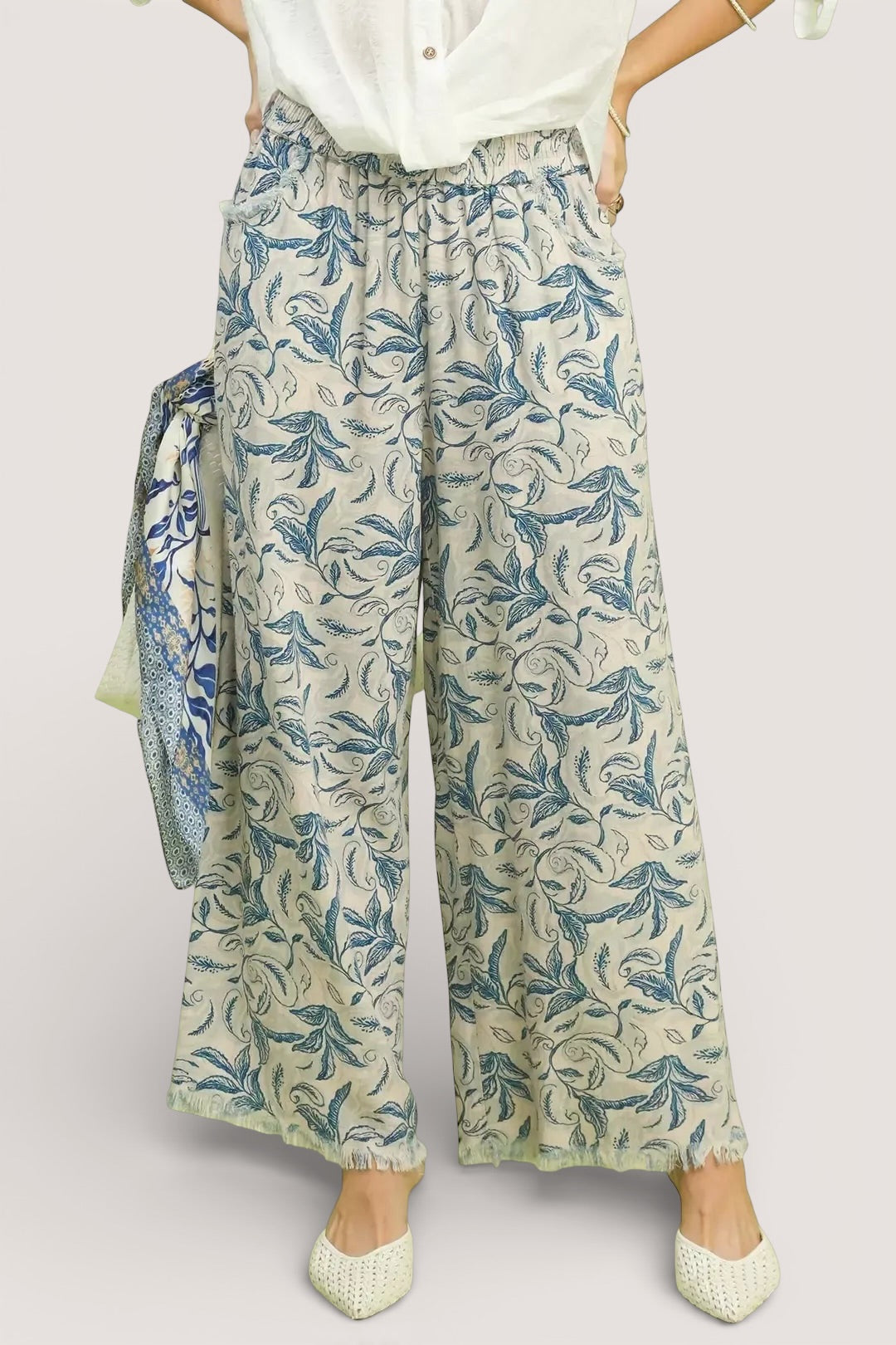 Umgee beige linen wide-leg pants with blue leafy print and raw frayed hems