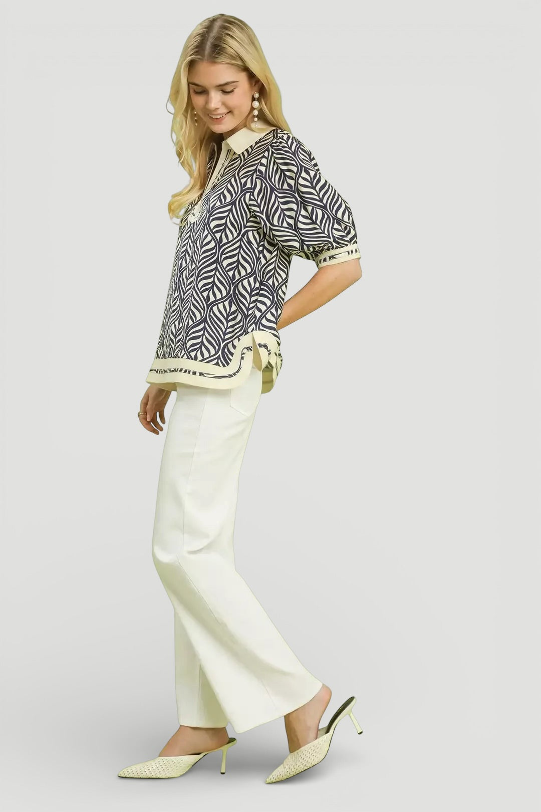 Woman in Umgee Geometric Leaf Print Popover Top with ivory trousers