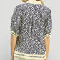 Woman in Umgee Geometric Leaf Print Popover Top, navy cream blouse