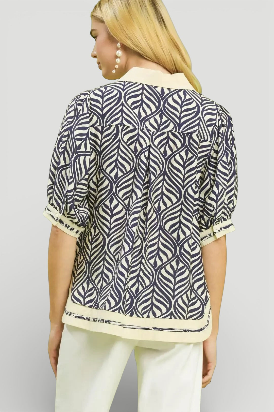 Woman in Umgee Geometric Leaf Print Popover Top, navy cream blouse
