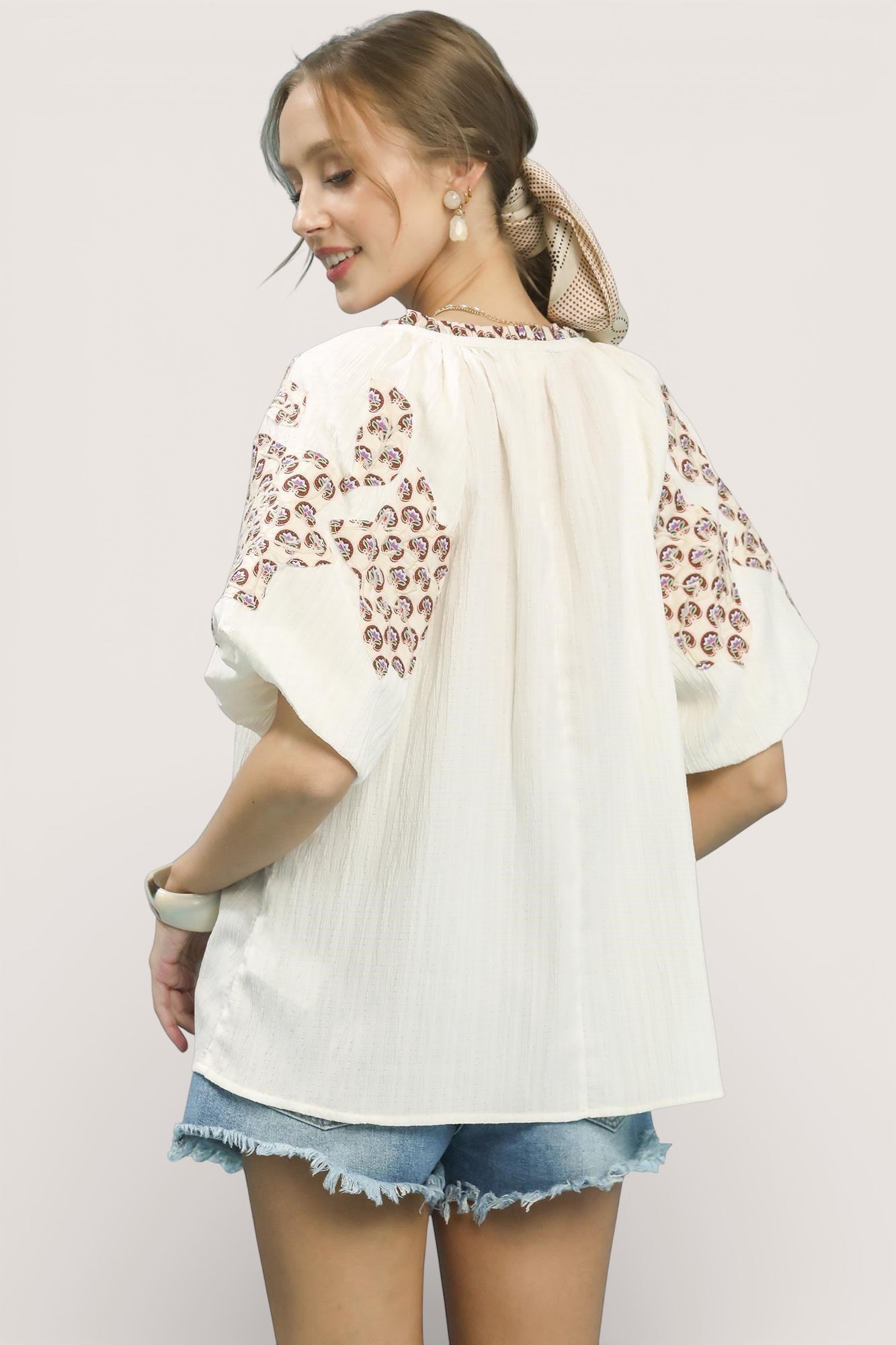 Umgee embroidered sleeve contrast trim top with white fabric and brown patterns