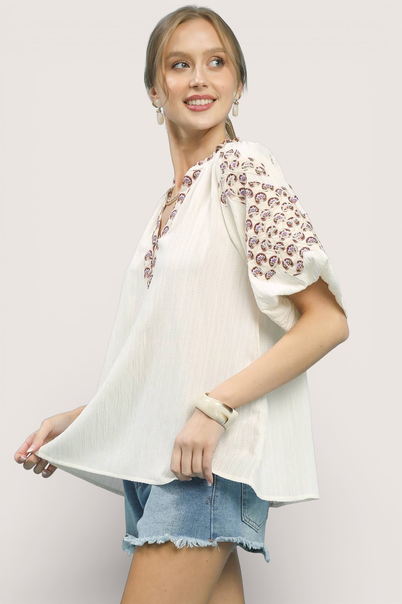Umgee embroidered sleeve contrast trim top with skull patterns