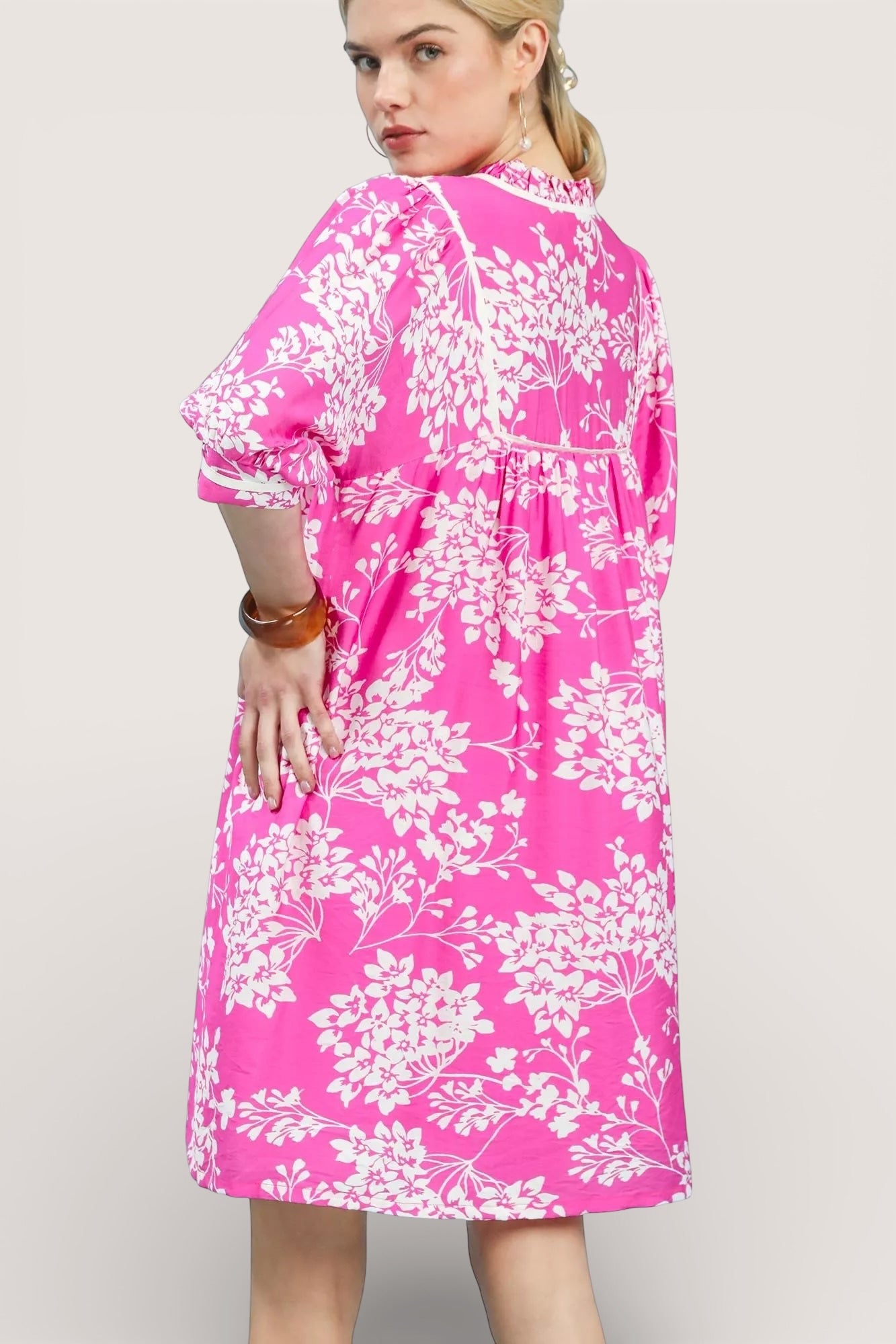 Umgee Floral Babydoll Dress with Pockets in vibrant pink with white floral pattern