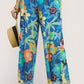 Umgee floral print wide-leg pants with blue flowers, frayed hems, drawstring waist