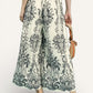 Umgee Border Print Wide Leg Pants in cream with black botanical pattern