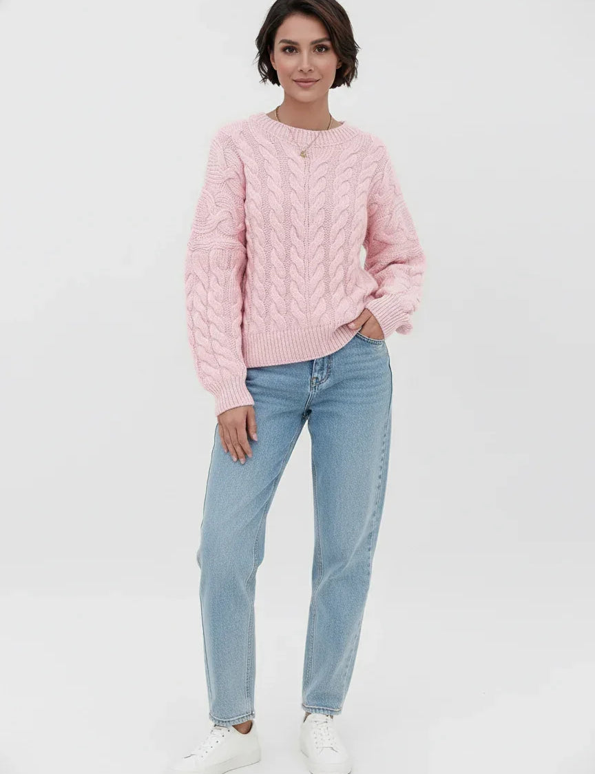 Pink cable knit long sleeve sweater with light blue jeans and white sneakers