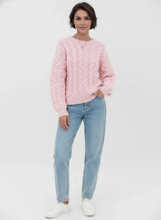 Pink cable knit long sleeve sweater with light blue jeans and white sneakers