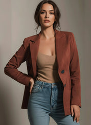 Brown double-breasted button-up lapel collar blazer with light blue jeans