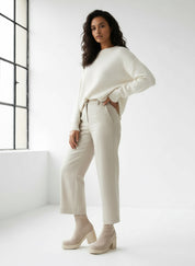 Cream cashmere sweater set with wide sleeves and cropped pants in Chunky Platform Sock Bootie