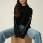Daverri Fashions black zip-up oversized mock neck sweater with jeans