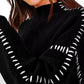 Daverri Fashions black turtleneck sweater with white sleeve patterns