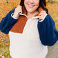Navy and taupe quarter-zip sherpa pullover with rust collar