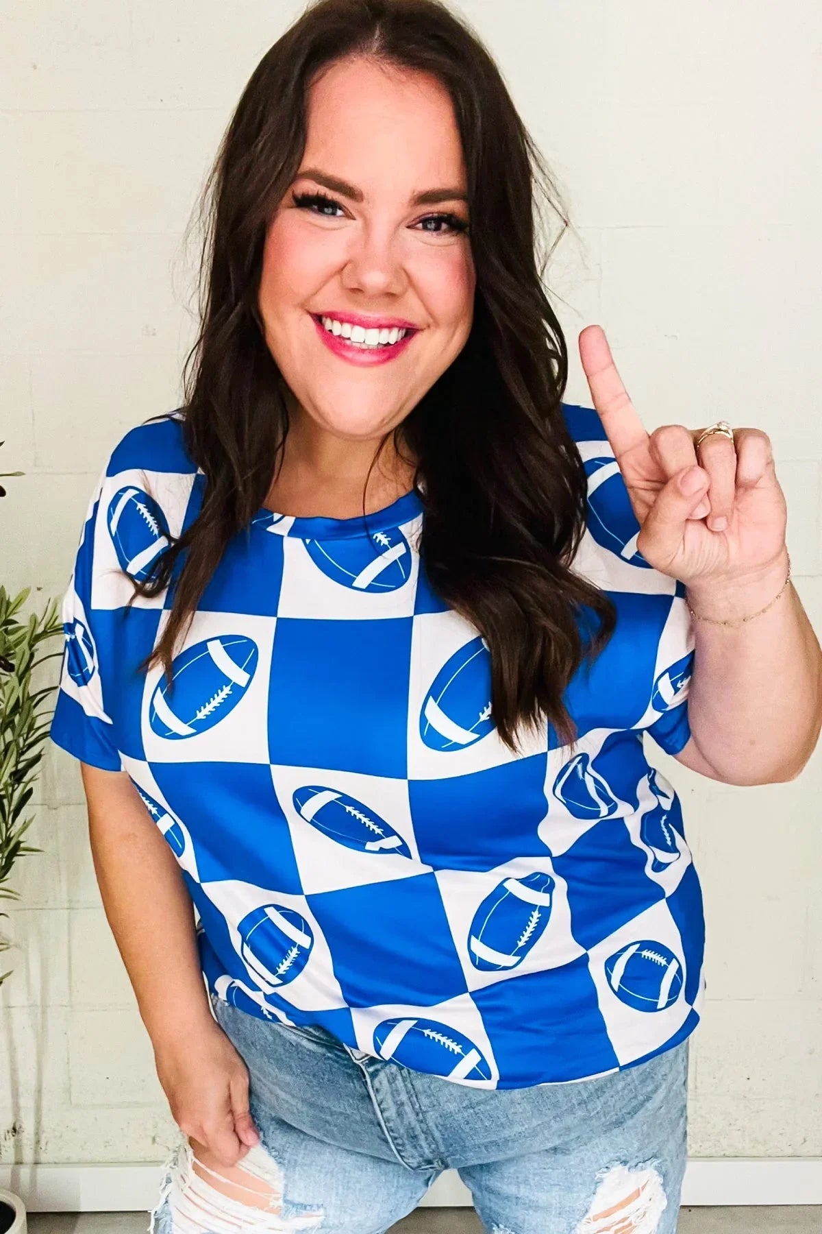 Turn Up The Volume Blue Football Checker Print Top | Daverri Fashions