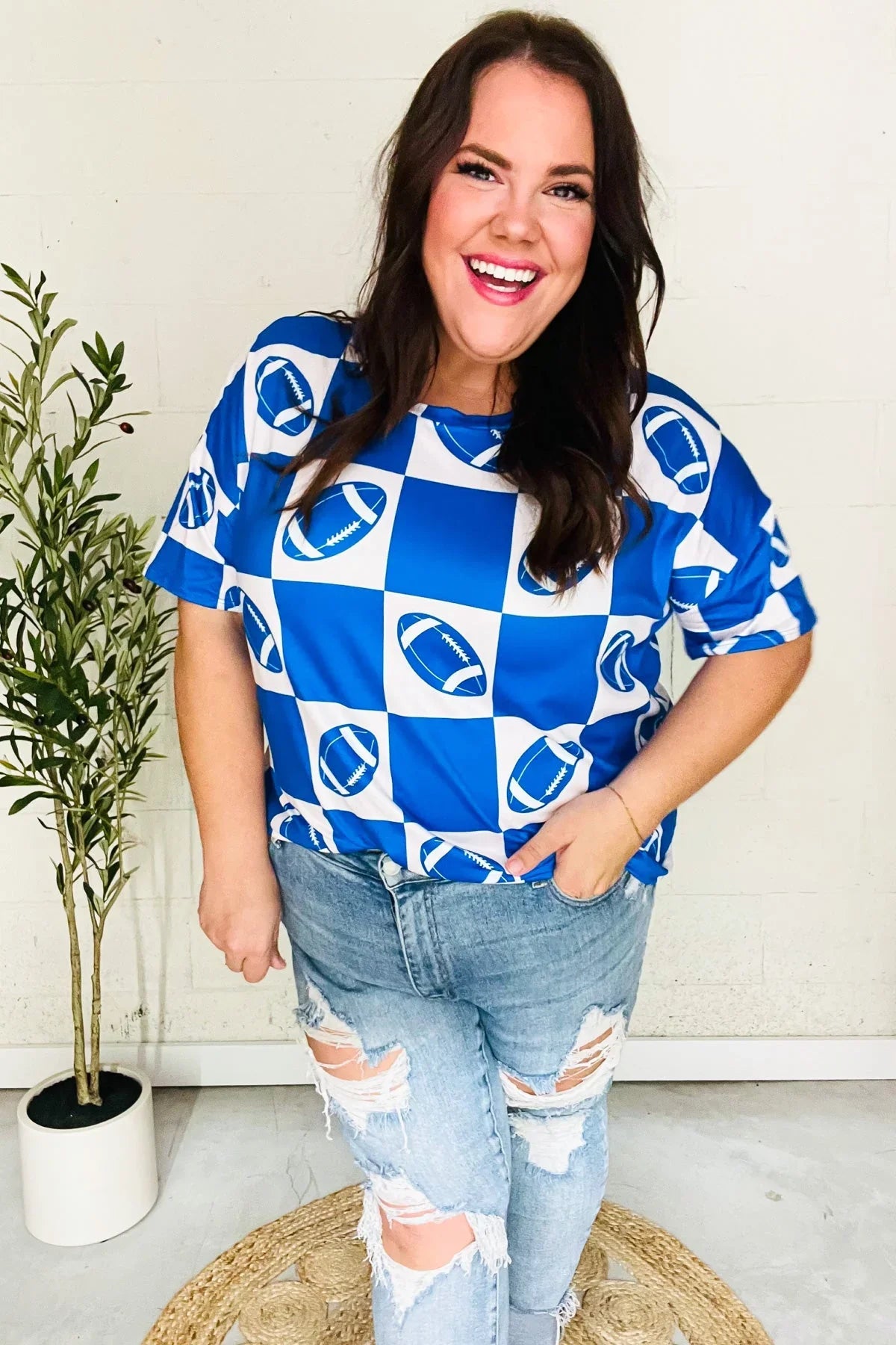 Turn Up The Volume Blue Football Checker Print Top | Daverri Fashions