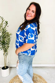 Turn Up The Volume Blue Football Checker Print Top | Daverri Fashions