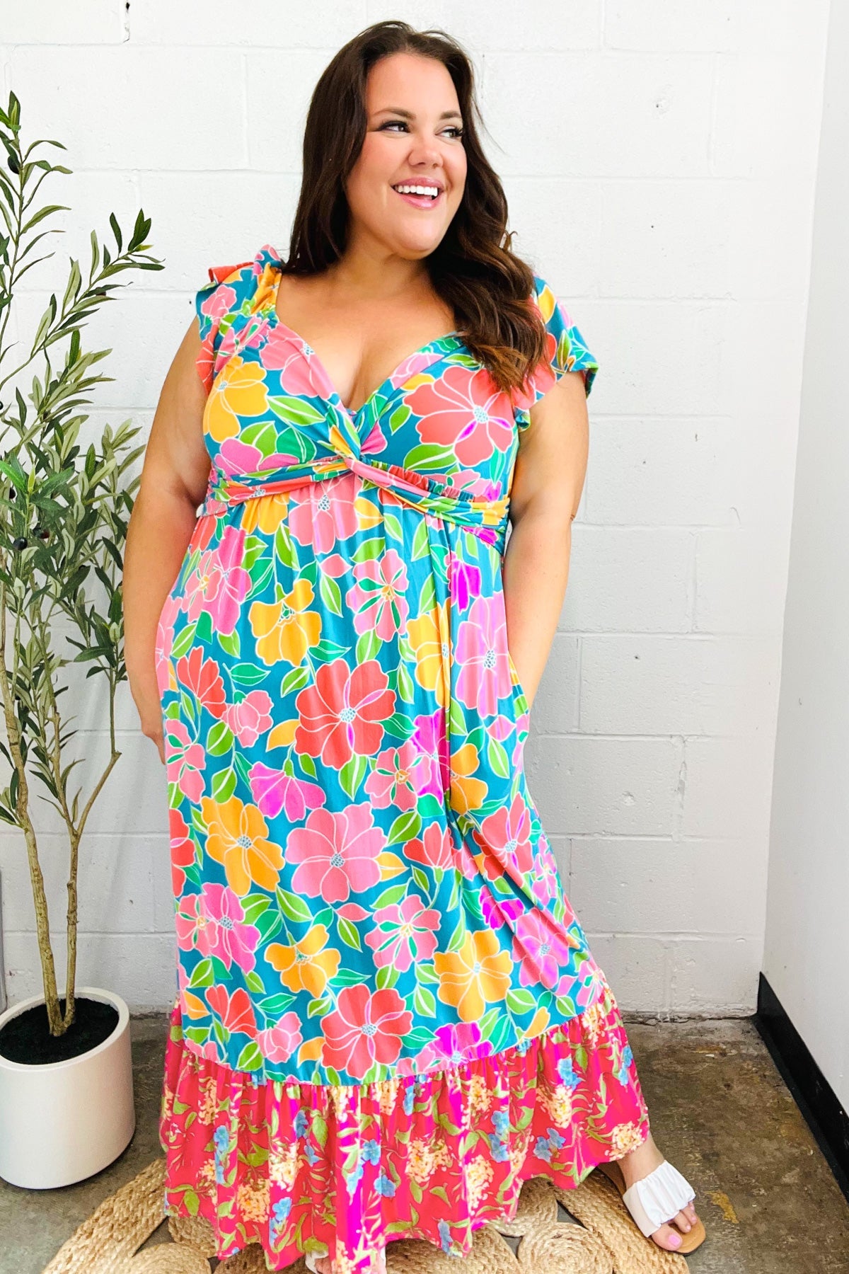 Vibrant turquoise floral maxi dress with sweetheart twisted neckline