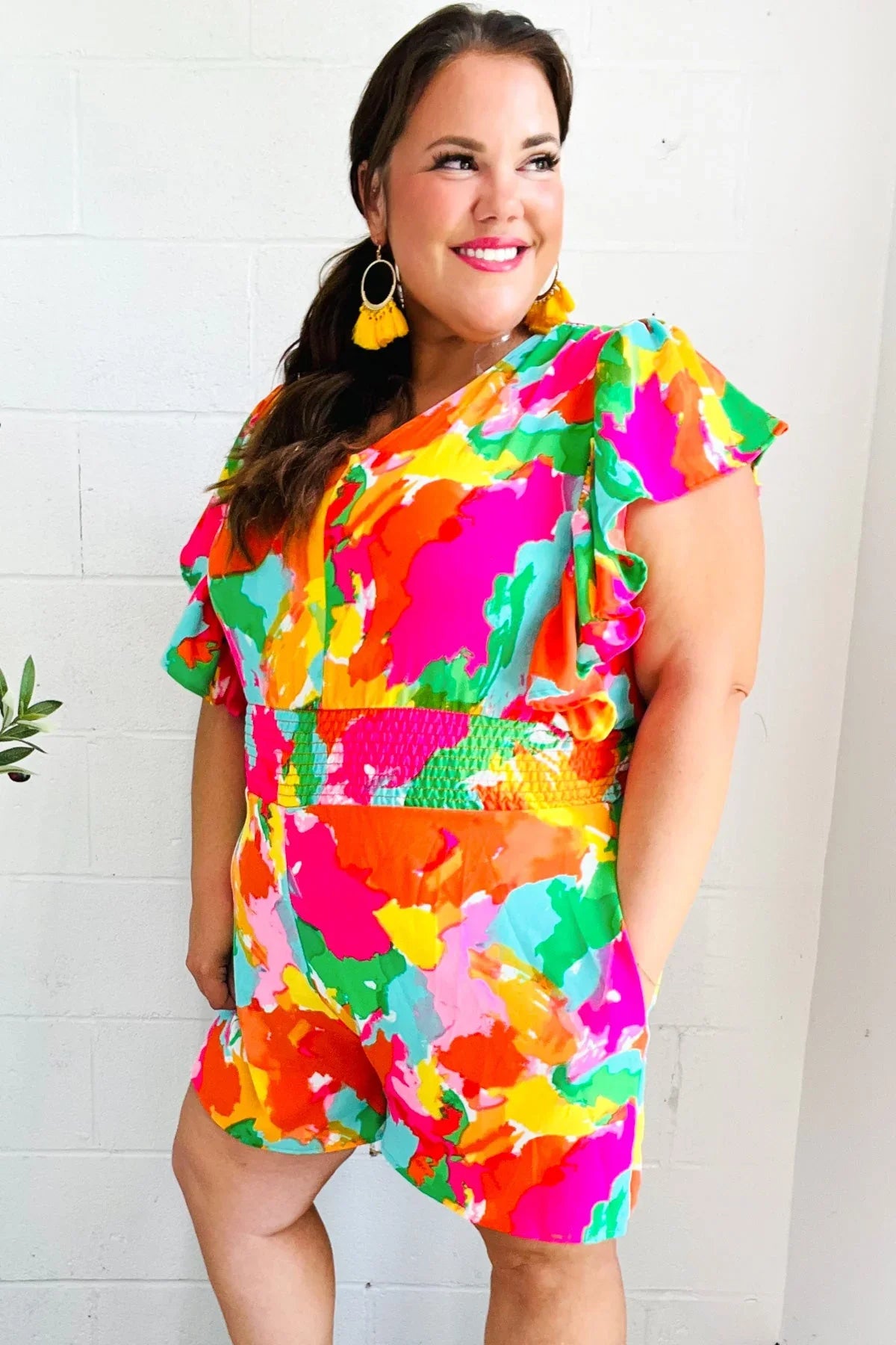 Neon floral plus size romper with ruffled sleeves and pockets