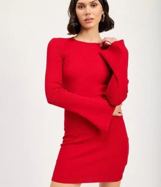 A woman wearing a long sleeve red mini dress