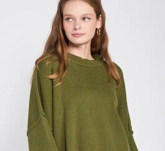 Woman wearing an olive sweater