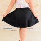 Just a Flirt Pleated Skirt in Black Skirts
